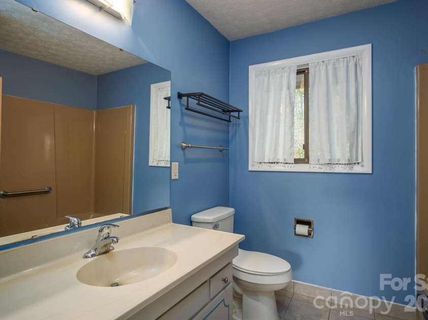 1813 Glen Cannon Drive, Pisgah Forest, NC 28768.  MLS# CAR4352130, YatesRealty ID 7298. Hall full bath