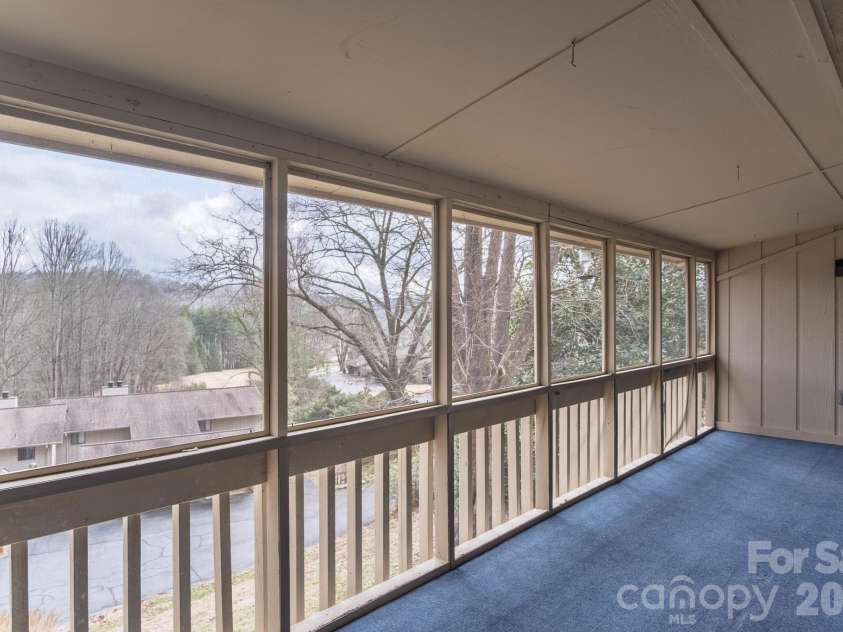 1813 Glen Cannon Drive, Pisgah Forest, NC 28768.  MLS# CAR4352130, YatesRealty ID 7298. Large screened and carpeted deck