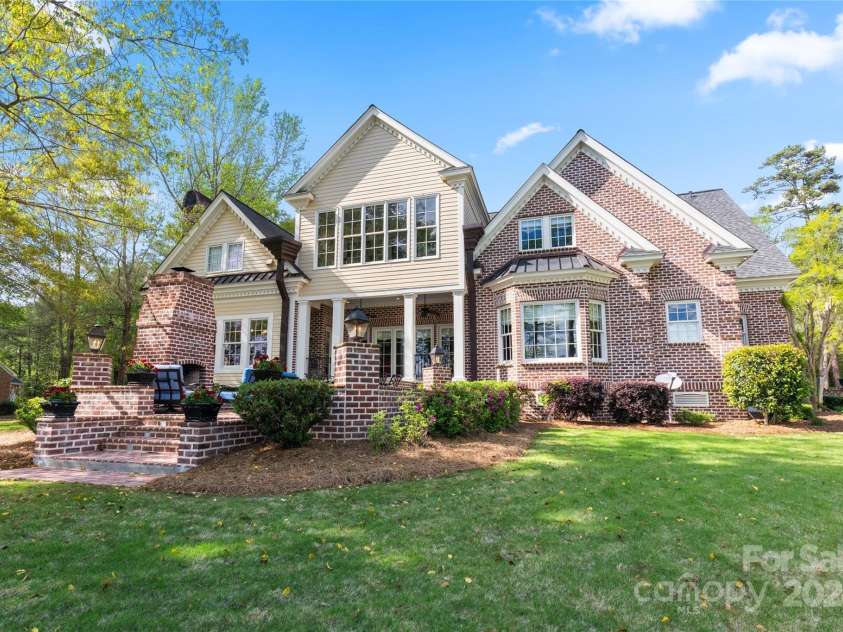 229 Joseph Kershaw Road, Eastover, SC 29044.  MLS# CAR4122309, YatesRealty ID 7302. Back of the home and patio, also a covered porch with built-in grill