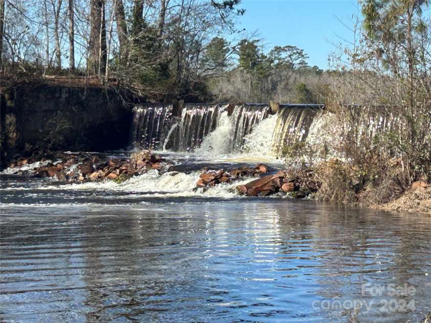 229 Joseph Kershaw Road, Eastover, SC 29044.  MLS# CAR4122309, YatesRealty ID 7302. Your own waterfall, just one of many tranquil places on the property