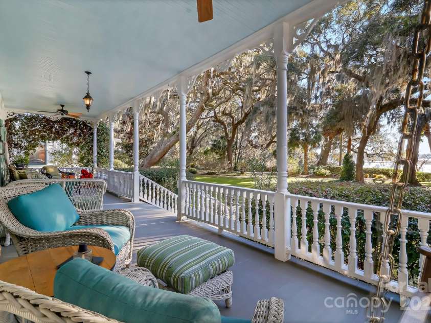 131 Pritchard Street, Bluffton, SC 29910.  MLS# CAR4214365, YatesRealty ID 7303. 42' front porch overlooking the river, water fountain, Live Oaks and capturing the breezes