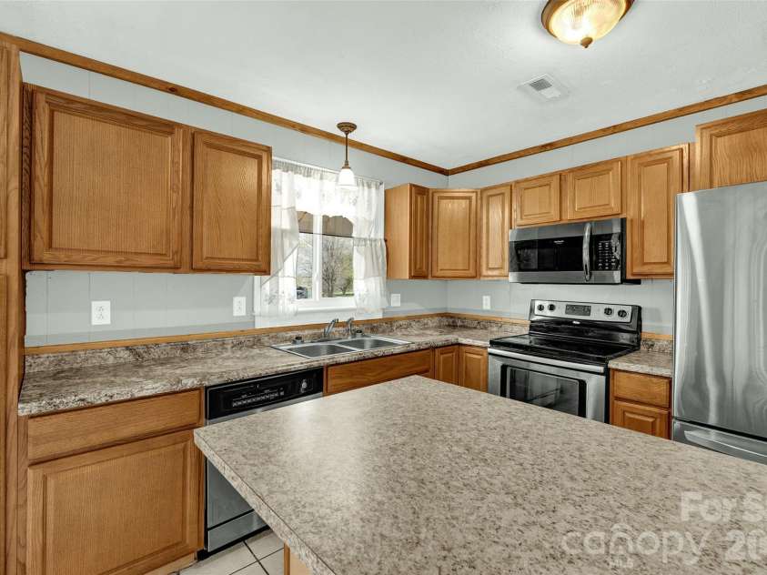 1090 Harris Bridge Road, Stony Point, NC 28678.  MLS# CAR4359624, YatesRealty ID 7305. New Refrigerator and Microwave
