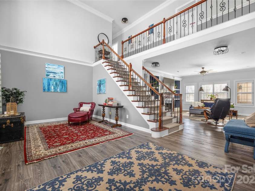 16115 Chiltern Lane, Huntersville, NC 28078.  MLS# CAR4233154, YatesRealty ID 7305. Living room and stairs