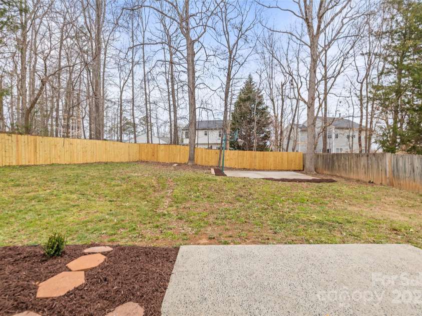 10211 Ridgewell Court, Charlotte, NC 28215.  MLS# CAR4227517, YatesRealty ID 7313. Beautiful flat yard