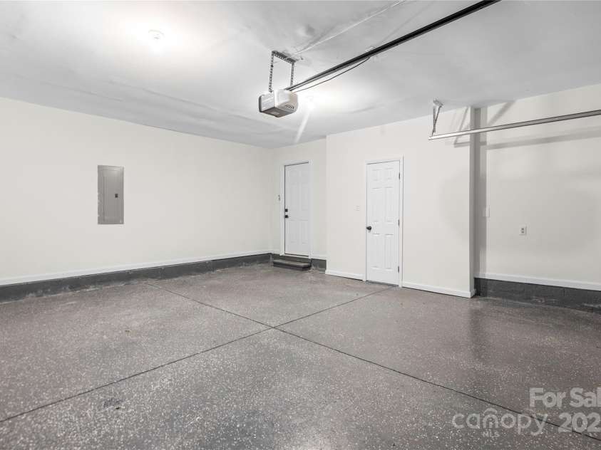10211 Ridgewell Court, Charlotte, NC 28215.  MLS# CAR4227517, YatesRealty ID 7313. Oversized 2-car garage with epoxy floor