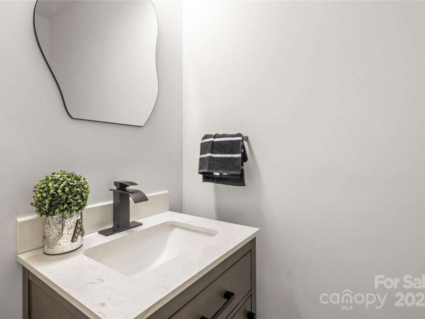 10211 Ridgewell Court, Charlotte, NC 28215.  MLS# CAR4227517, YatesRealty ID 7313. Stunning half bath on main level