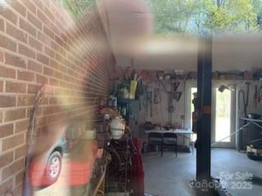 2399 PLEASANT GROVE Road, Hendersonville, NC 28739.  MLS# CAR4247893, YatesRealty ID 7314. ,, AT RIGHT END OF 5 GARAGES AND PADS.