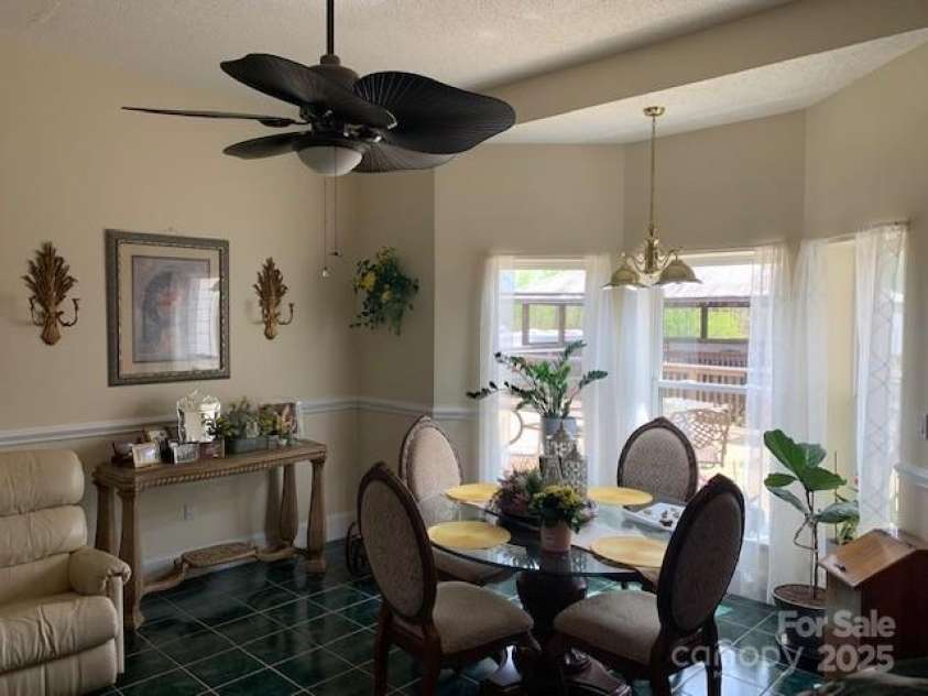 2399 PLEASANT GROVE Road, Hendersonville, NC 28739.  MLS# CAR4247893, YatesRealty ID 7314. DINING BREAKFAST NOOK BY 1ST FL KITCHEN ... ACCESS TO DECK, DINING ROOM, ENTERTAINING, ETC.