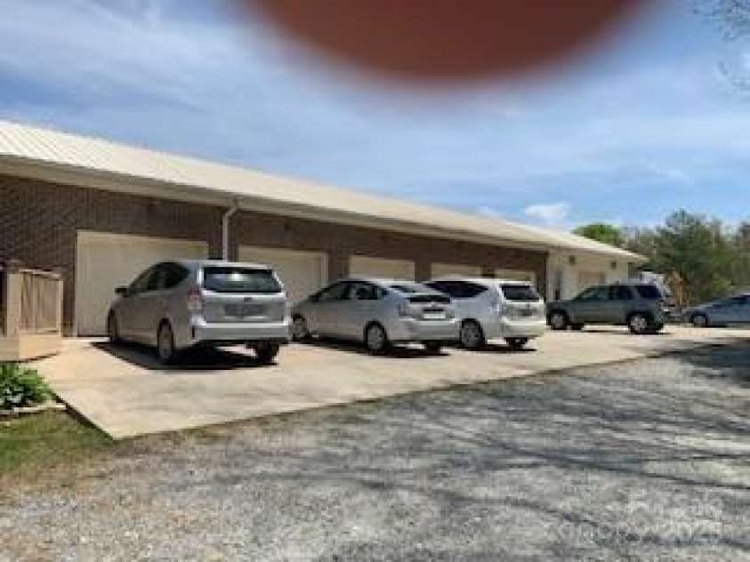 2399 PLEASANT GROVE Road, Hendersonville, NC 28739.  MLS# CAR4247893, YatesRealty ID 7314. From, pull up to 6 car garage, note LIFT @end