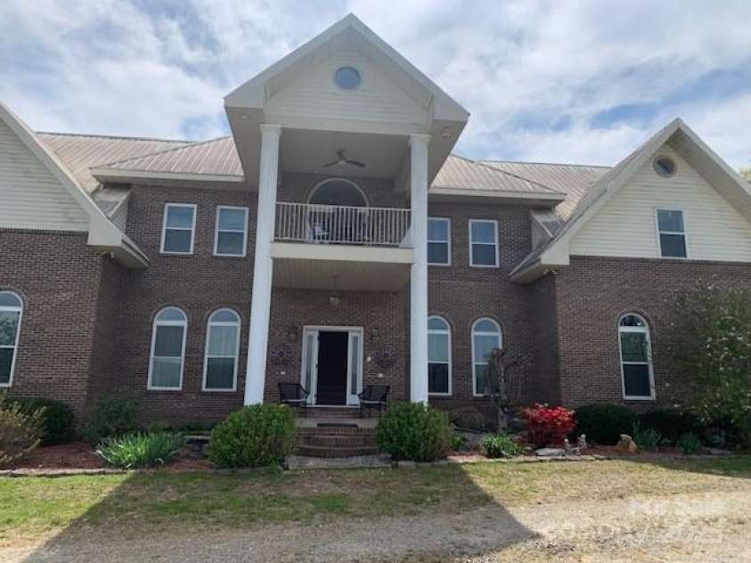 2399 PLEASANT GROVE Road, Hendersonville, NC 28739.  MLS# CAR4247893, YatesRealty ID 7314. Front Courtyard Entry,NOTE: Upper Balcony