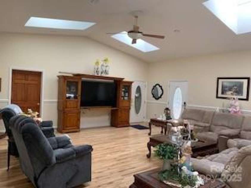 2399 PLEASANT GROVE Road, Hendersonville, NC 28739.  MLS# CAR4247893, YatesRealty ID 7314. LOWER DEN, very large with private full bath