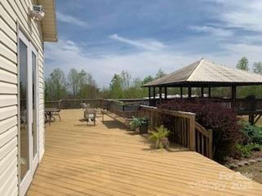 2399 PLEASANT GROVE Road, Hendersonville, NC 28739.  MLS# CAR4247893, YatesRealty ID 7314. Off Large Back Den is a Wonder Deck & Gazebo