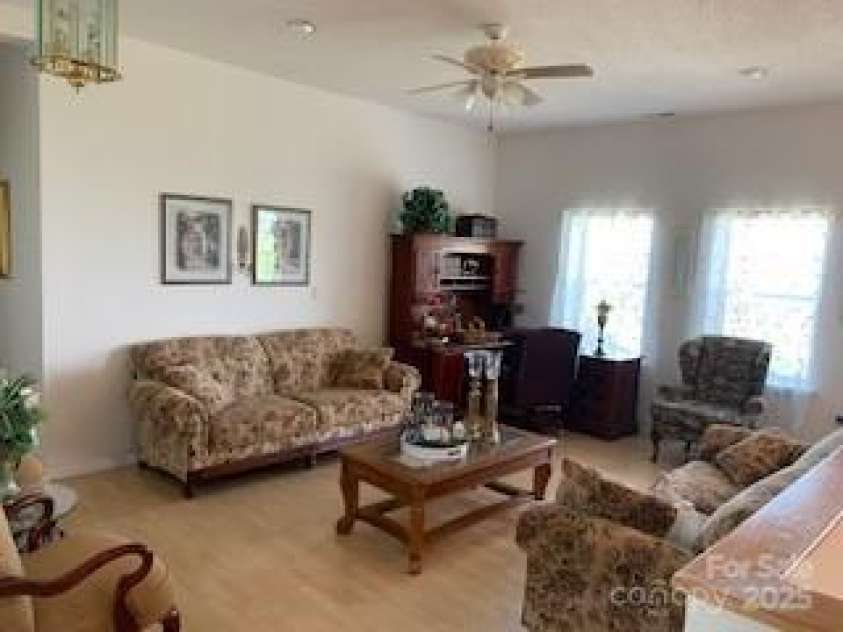 2399 PLEASANT GROVE Road, Hendersonville, NC 28739.  MLS# CAR4247893, YatesRealty ID 7314. UPPER SITTING AREA, NEAR STEPS AND DESIGN BRACE FOR FUTURE ELEVATOR (NOT PRESENT)