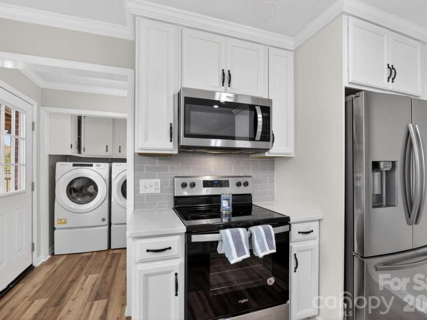 1037 Prestwood Drive, Lenoir, NC 28645.  MLS# CAR4351995, YatesRealty ID 7339. Kitchen looking into mud room, laundry on main level