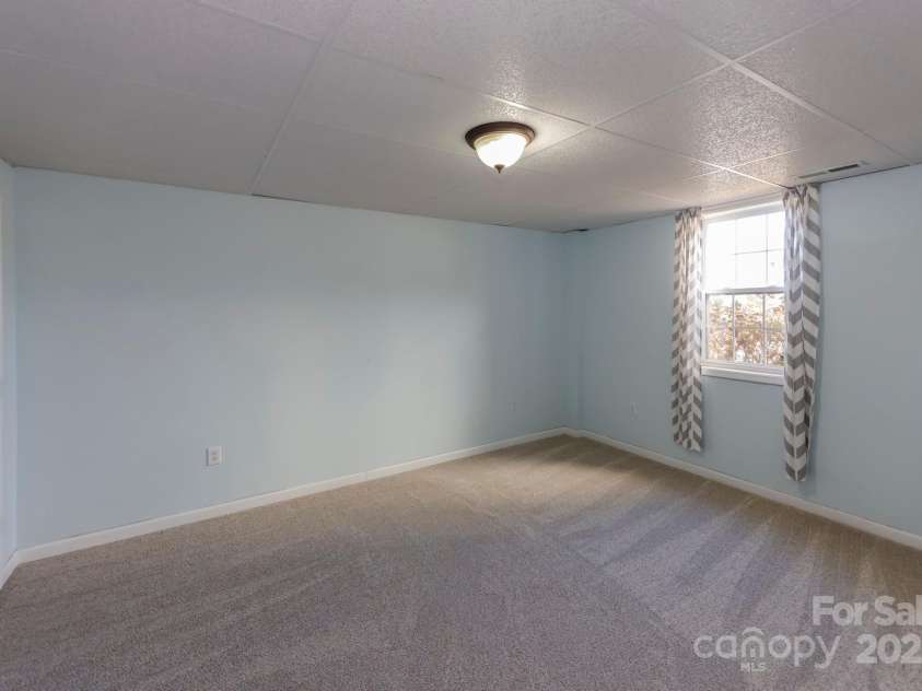 640 Laurel Heights Lane, Tryon, NC 28782.  MLS# CAR4212228, YatesRealty ID 7354. BR #5 Basement