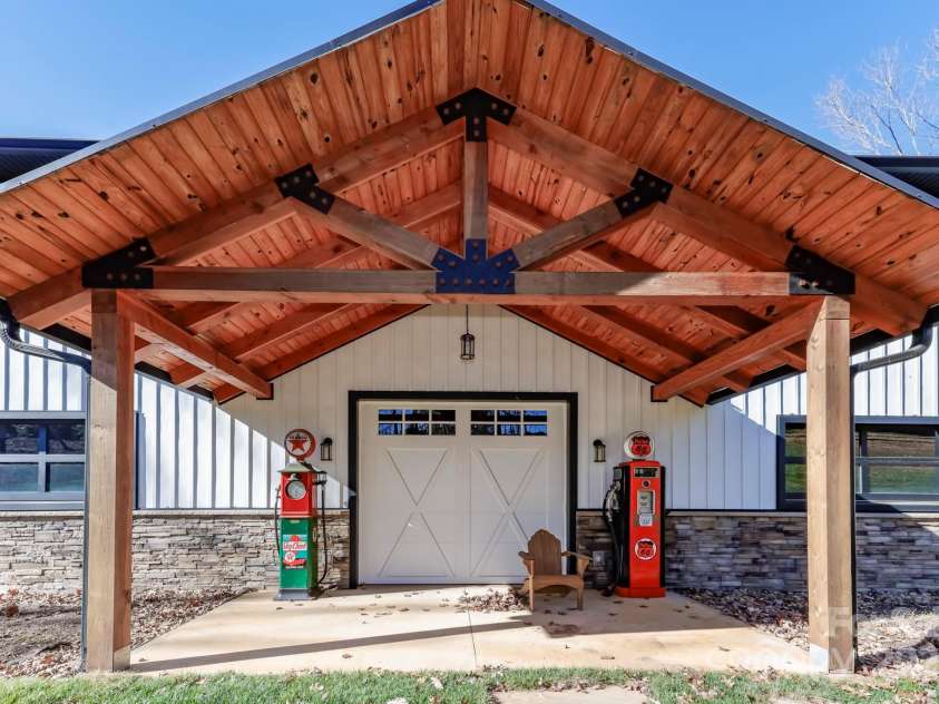 640 Laurel Heights Lane, Tryon, NC 28782.  MLS# CAR4212228, YatesRealty ID 7354. Covered Side porch off building