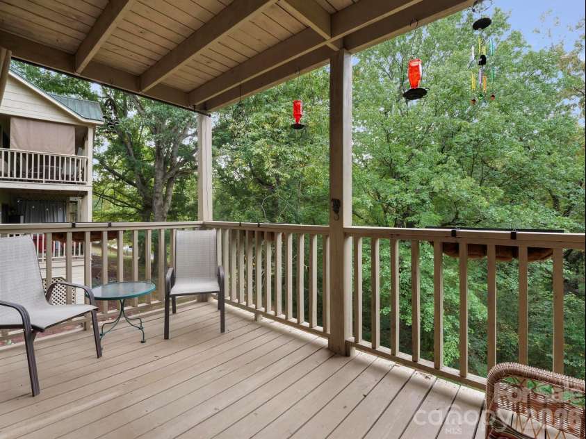 160 Whitney Boulevard, Lake Lure, NC 28746.  MLS# CAR4364801, YatesRealty ID 736. Back deck overlooking woods