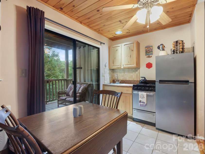 160 Whitney Boulevard, Lake Lure, NC 28746.  MLS# CAR4364801, YatesRealty ID 736. Drop leaf table, full size fridge, 4 burner stove/oven