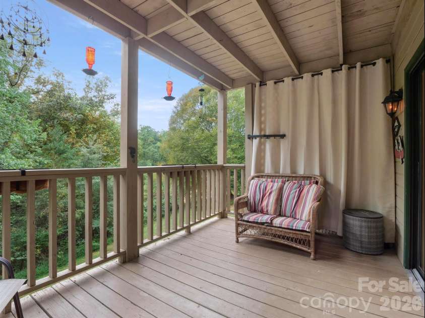 160 Whitney Boulevard, Lake Lure, NC 28746.  MLS# CAR4364801, YatesRealty ID 736. Privacy curtains on both sides