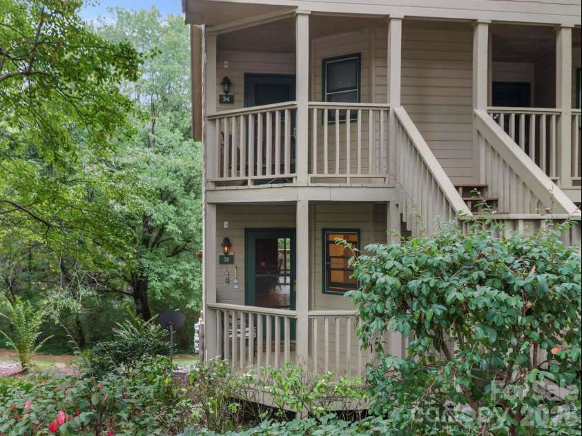 160 Whitney Boulevard, Lake Lure, NC 28746.  MLS# CAR4364801, YatesRealty ID 736. Welcome to Apple Valley Villa #31