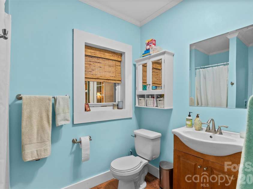 1087 Turkey Creek Road, Leicester, NC 28748.  MLS# CAR4358676, YatesRealty ID 7371. Main level bathroom has new floors and paint
