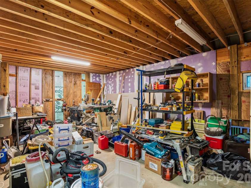 1087 Turkey Creek Road, Leicester, NC 28748.  MLS# CAR4358676, YatesRealty ID 7371. The lower level workshop has plenty of space for your tools and projects! Also can be used for parking your vehicles, 4 wheelers, UTVs, dirt bikes, etc!