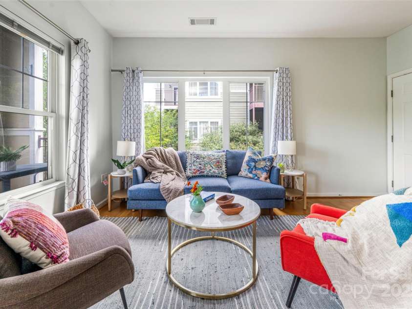 64 Clingman Avenue, Asheville, NC 28801.  MLS# CAR4285759, YatesRealty ID 7381. Abundant light filled living room