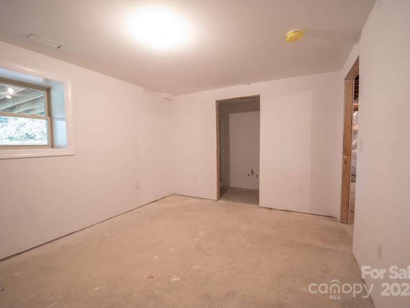 110 Glenwood Lane, Hendersonville, NC 28792.  MLS# CAR4177654, YatesRealty ID 7388. Lower level bedroom
