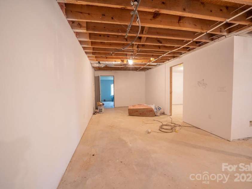110 Glenwood Lane, Hendersonville, NC 28792.  MLS# CAR4177654, YatesRealty ID 7388. Unfinished basement area