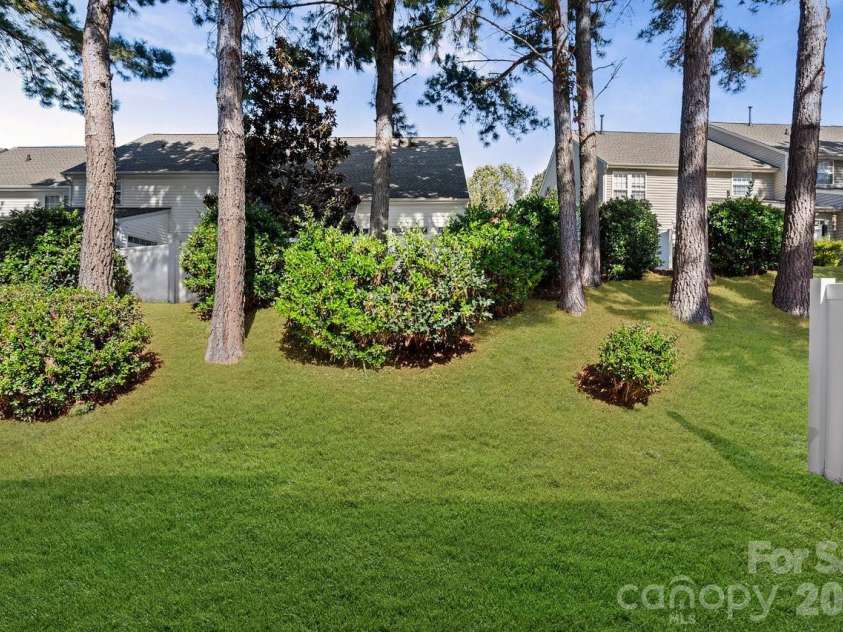 152 Cypress Landing Drive, Mooresville, NC 28117.  MLS# CAR4317896, YatesRealty ID 7388. Backyard space ready for spring flowers.