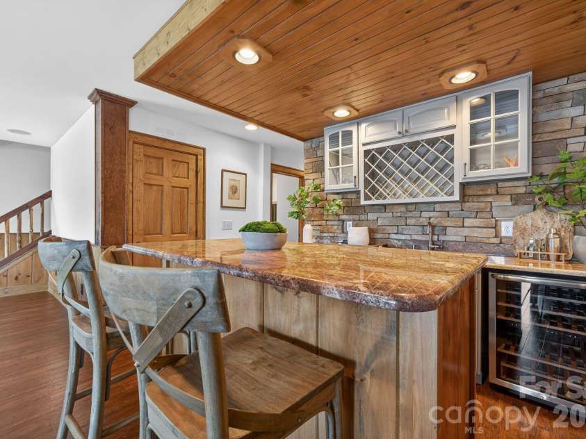 8428 Island Point Road, Charlotte, NC 28278.  MLS# CAR4358970, YatesRealty ID 7398. Full wet bar with seating, two beverage refrigerators and a sink