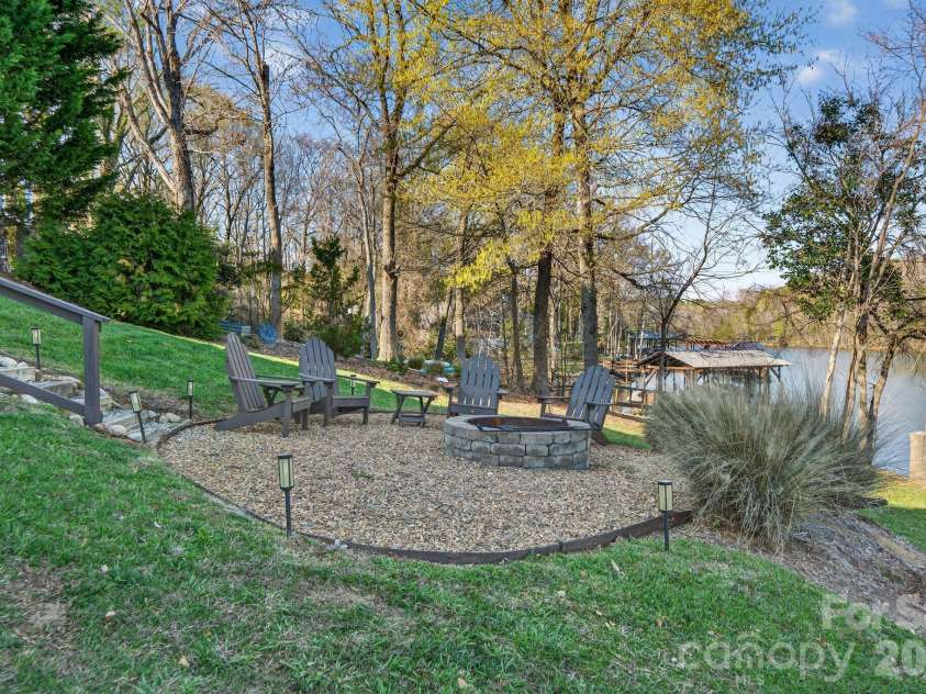 8428 Island Point Road, Charlotte, NC 28278.  MLS# CAR4358970, YatesRealty ID 7398. Lakeside firepit for evenings by the water