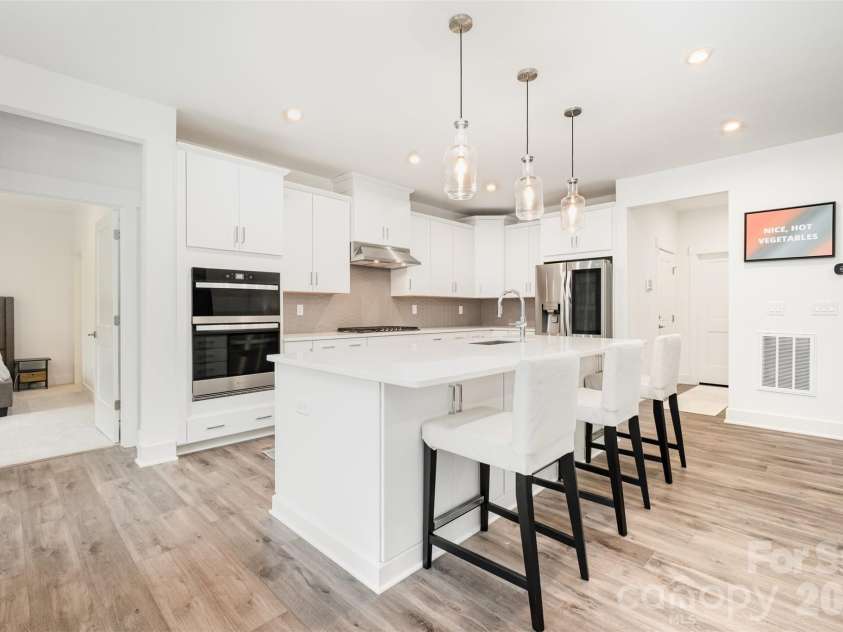 5216 Mint Harbor Way, Charlotte, NC 28269.  MLS# CAR4316519, YatesRealty ID 7403. Very large kitchen with entertaining space