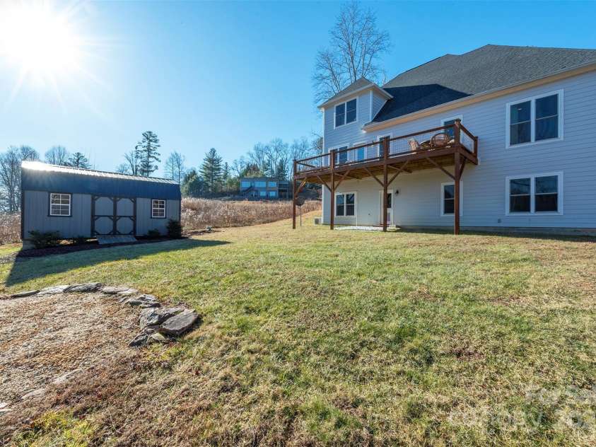 108 Course Drive, Etowah, NC 28729.  MLS# CAR4216088, YatesRealty ID 7406. Addition storage space in an attractive separate shed located in the backyard with invisible fencing makes this home ready for even the furry members of the family! Flat yard space provides many options for future projects.