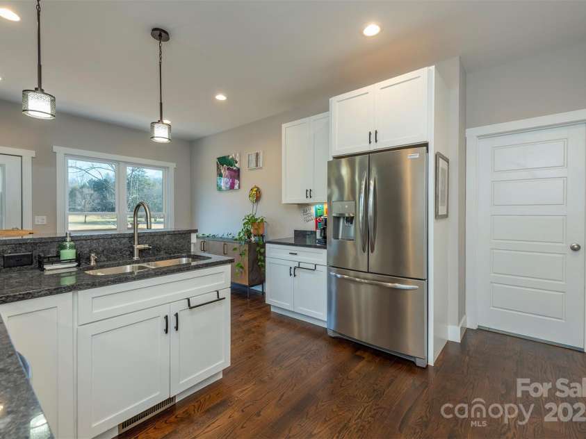 108 Course Drive, Etowah, NC 28729.  MLS# CAR4216088, YatesRealty ID 7406. Large windows supplement with tons of natural light