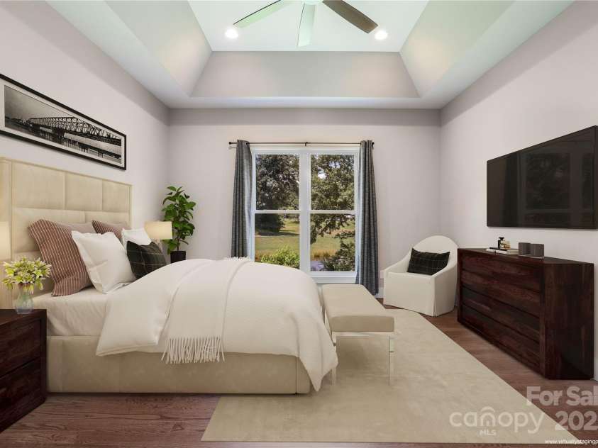 108 Course Drive, Etowah, NC 28729.  MLS# CAR4216088, YatesRealty ID 7406. Massive primary bedroom on the main level with water views (virtually staged)