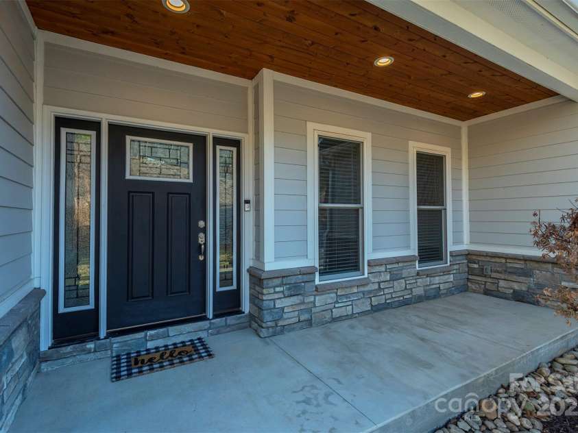 108 Course Drive, Etowah, NC 28729.  MLS# CAR4216088, YatesRealty ID 7406. Welcoming front entry ---that detailed porch ceiling!