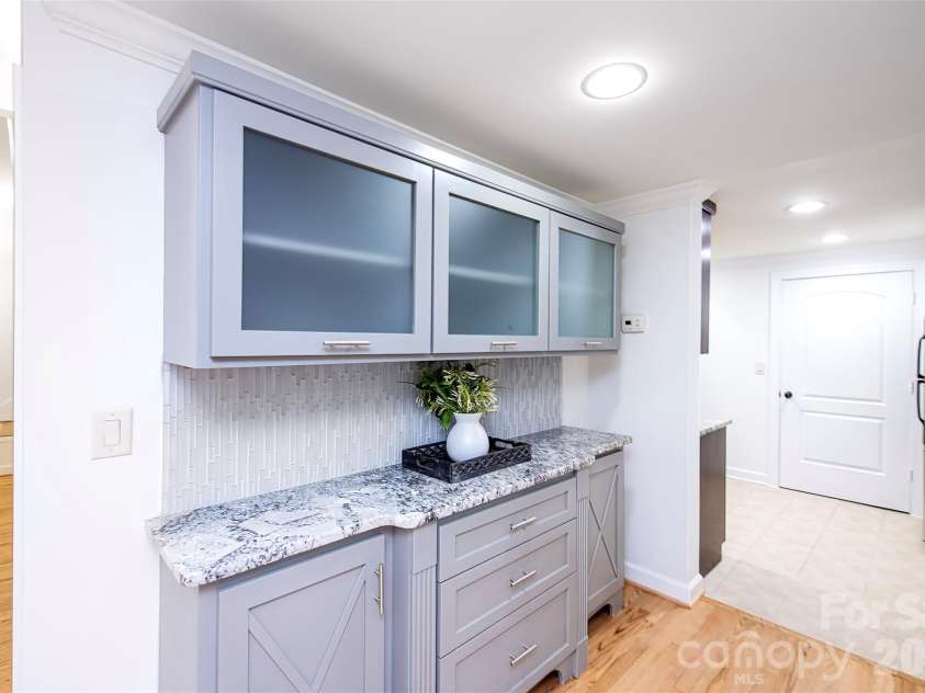 939 Linda Lane, Charlotte, NC 28211.  MLS# CAR4360605, YatesRealty ID 7408. Built-ins - perfect for storage and food display in basement