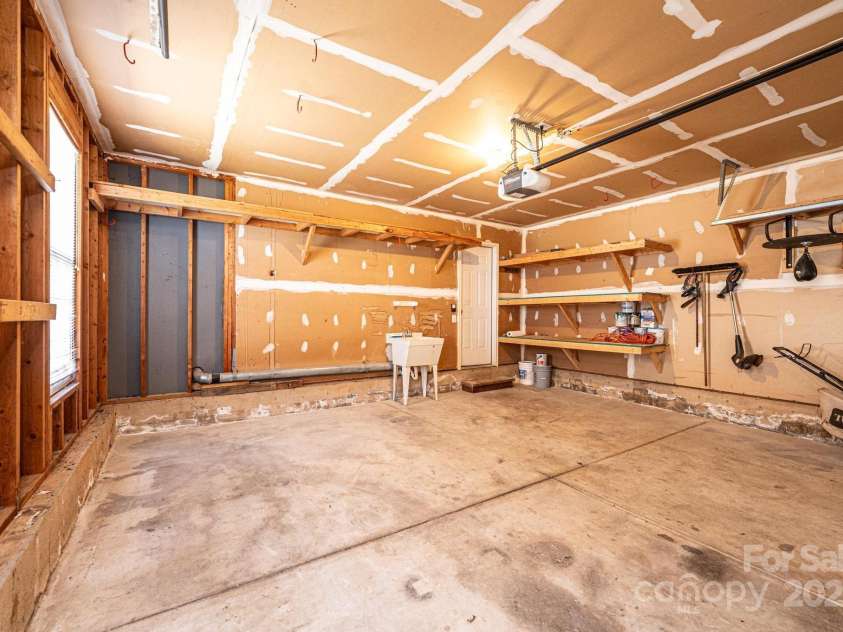 102 Brewster Court, Mooresville, NC 28115.  MLS# CAR4223330, YatesRealty ID 7417. 2 car garage w/ utility sink and storage space