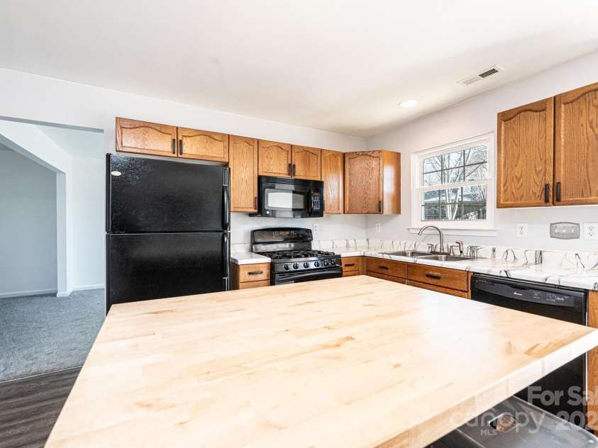 102 Brewster Court, Mooresville, NC 28115.  MLS# CAR4223330, YatesRealty ID 7417. Butcher Block island top