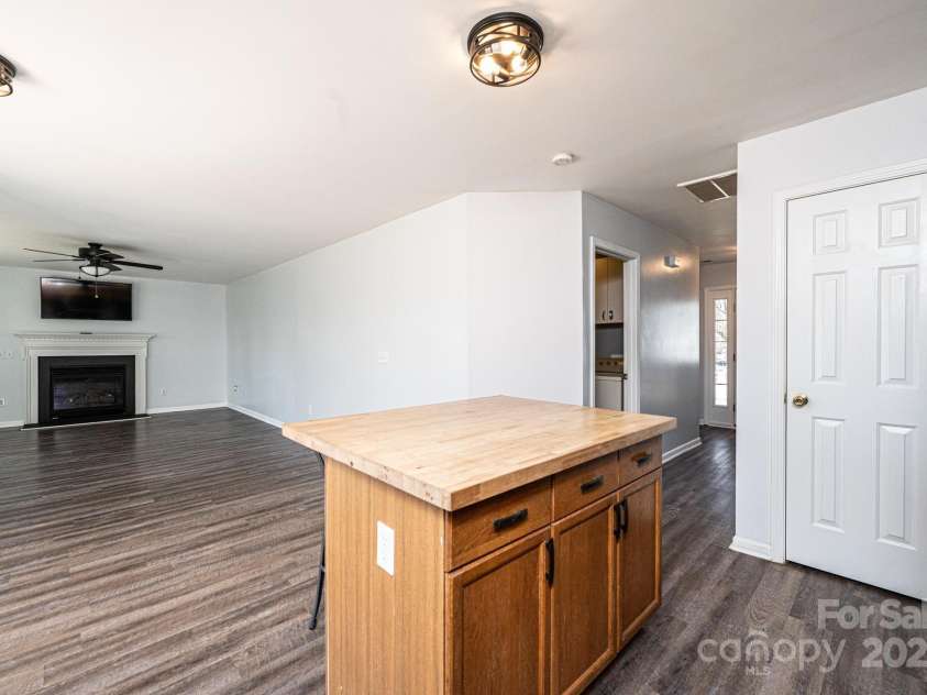 102 Brewster Court, Mooresville, NC 28115.  MLS# CAR4223330, YatesRealty ID 7417. View of the living room from the kitchen