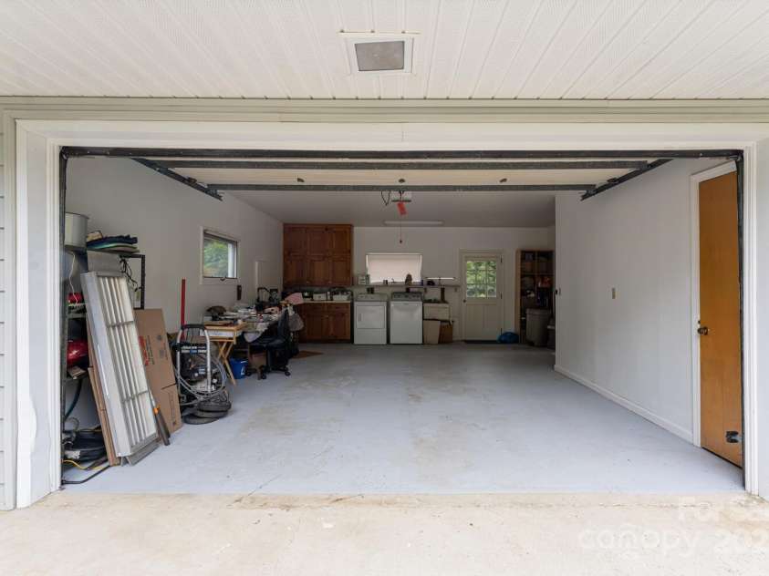 3870 Kanuga Road, Hendersonville, NC 28739.  MLS# CAR4209718, YatesRealty ID 7420. Basement Garage