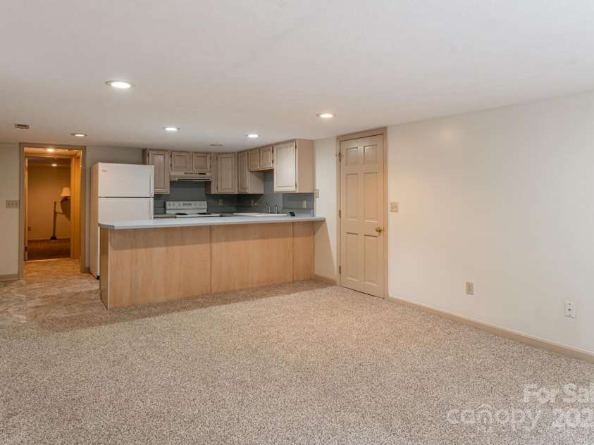 3870 Kanuga Road, Hendersonville, NC 28739.  MLS# CAR4209718, YatesRealty ID 7420. Downstairs Living Area