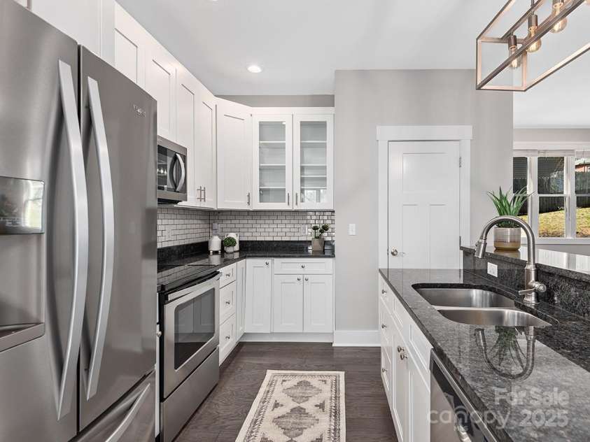 34 Walnut Lane, Asheville, NC 28804.  MLS# CAR4233293, YatesRealty ID 7421. Kitchen features walk in pantry for additional storage