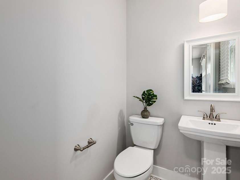 34 Walnut Lane, Asheville, NC 28804.  MLS# CAR4233293, YatesRealty ID 7421. Main level bathroom with modern finishes