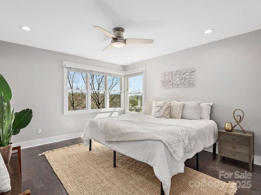 34 Walnut Lane, Asheville, NC 28804.  MLS# CAR4233293, YatesRealty ID 7421. Primary bedroom soaks in natural light and mountain views