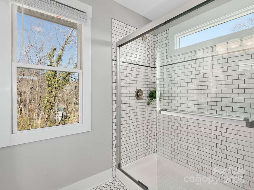34 Walnut Lane, Asheville, NC 28804.  MLS# CAR4233293, YatesRealty ID 7421. Spa-like walk in shower