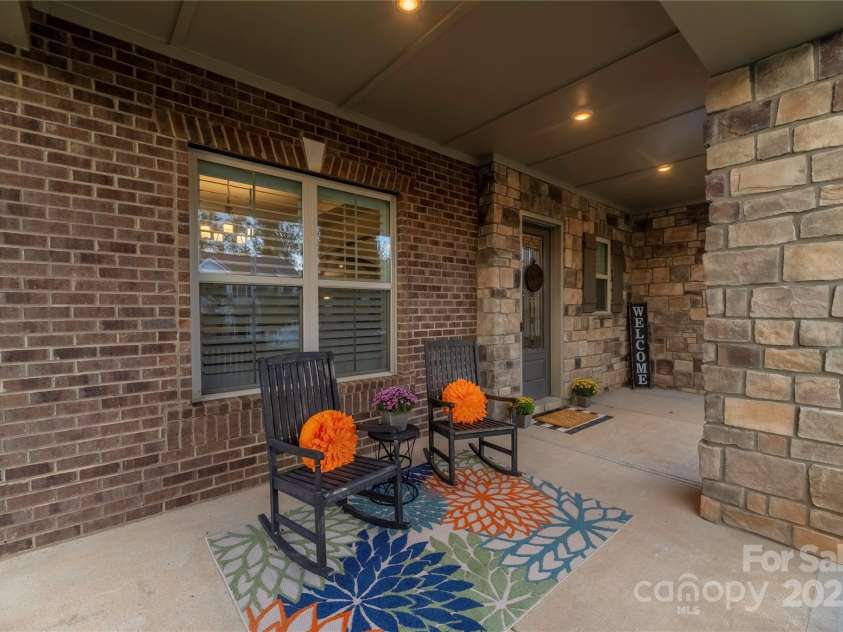 16827 Monocacy Boulevard, Huntersville, NC 28078.  MLS# CAR4188848, YatesRealty ID 7429. Large rocking chair Covered Porch