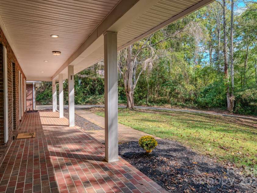 35 Byrd Road, Candler, NC 28715.  MLS# CAR4314143, YatesRealty ID 743. Covered porch runs the entire span of the dwelling