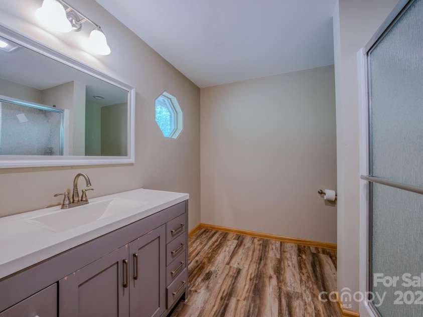 35 Byrd Road, Candler, NC 28715.  MLS# CAR4314143, YatesRealty ID 743. Fully remodeled primary en suite bathroom